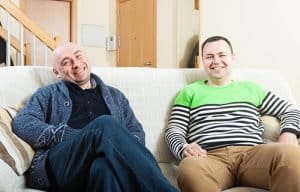 two men laugh at an inpatient alcohol rehab