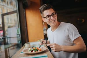man eating salad receives nutrition education