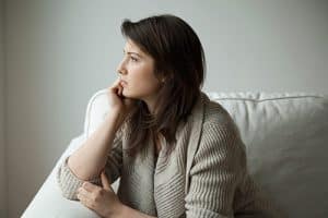 A woman thinking about Hydrocodone addiction rehab