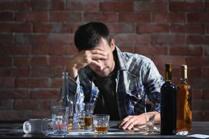 Man thinking about his alcohol addiction treatment