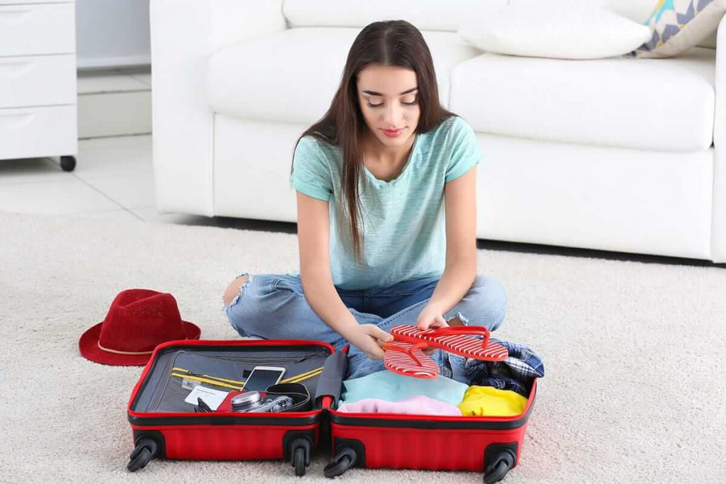 woman packs for addiction rehab using a list of what to bring to rehab