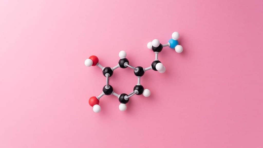 Dopamine cheimcal formula over pink background