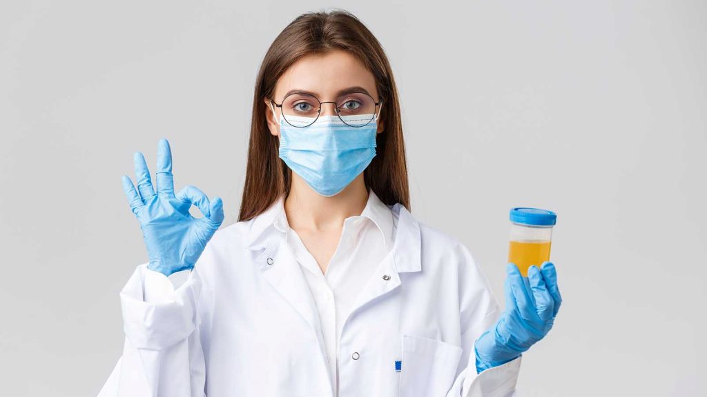 doctor holding up a urine test
