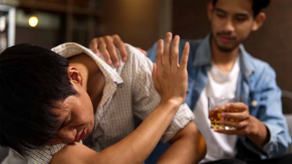 man-refusing-alcohol-from-friend